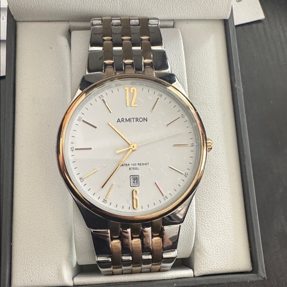 Armitron Gold and Silver Watch ظit’s new But need a Battery